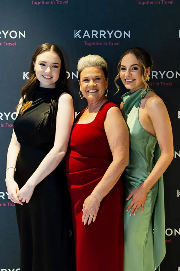 Party starter: Karryon Glam Club rocks the 2025 NTIAs with 100-plus travel industry revellers 1 3 women in formal attire in front of media wall at Karryon Glam Club 2025.