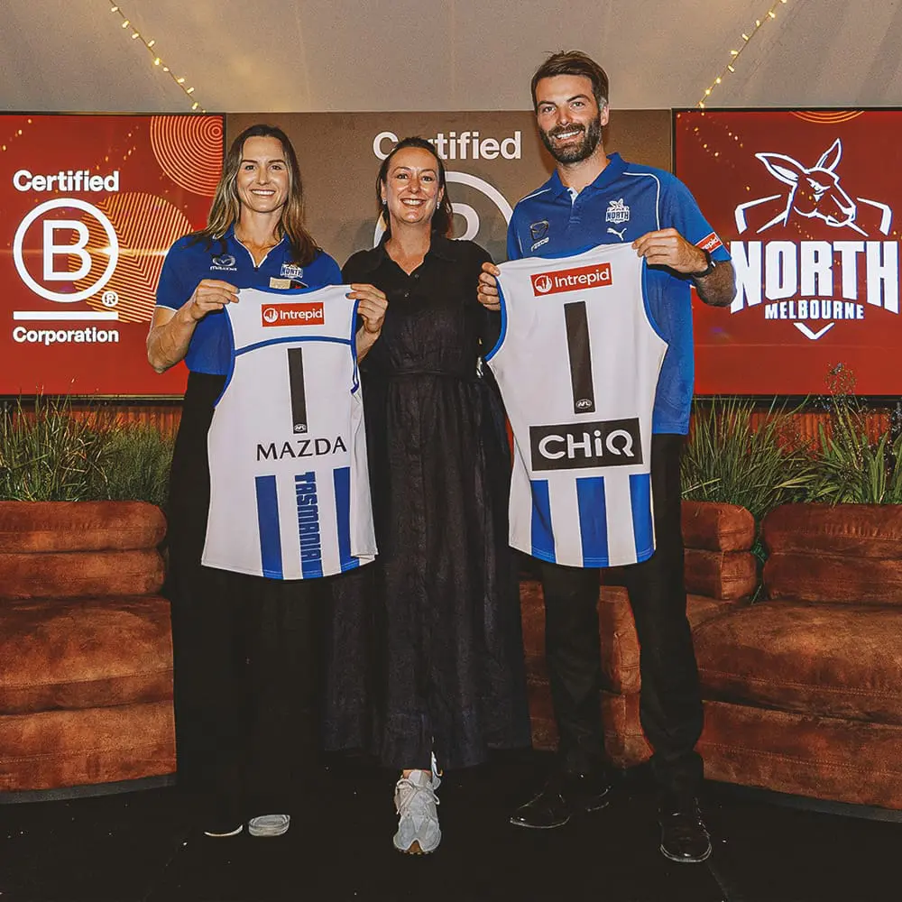 Kicking sustainable goals: Intrepid Travel plays on as North Melbourne club partner for two more years 2 NMFC AFLW Midfielder Eilish Sheerin & NMFC AFL Medium Defender Luke McDonald with Intrepid Travel ANZ GM Yvette Thompson (centre) at the NFMC B Corp announcement.