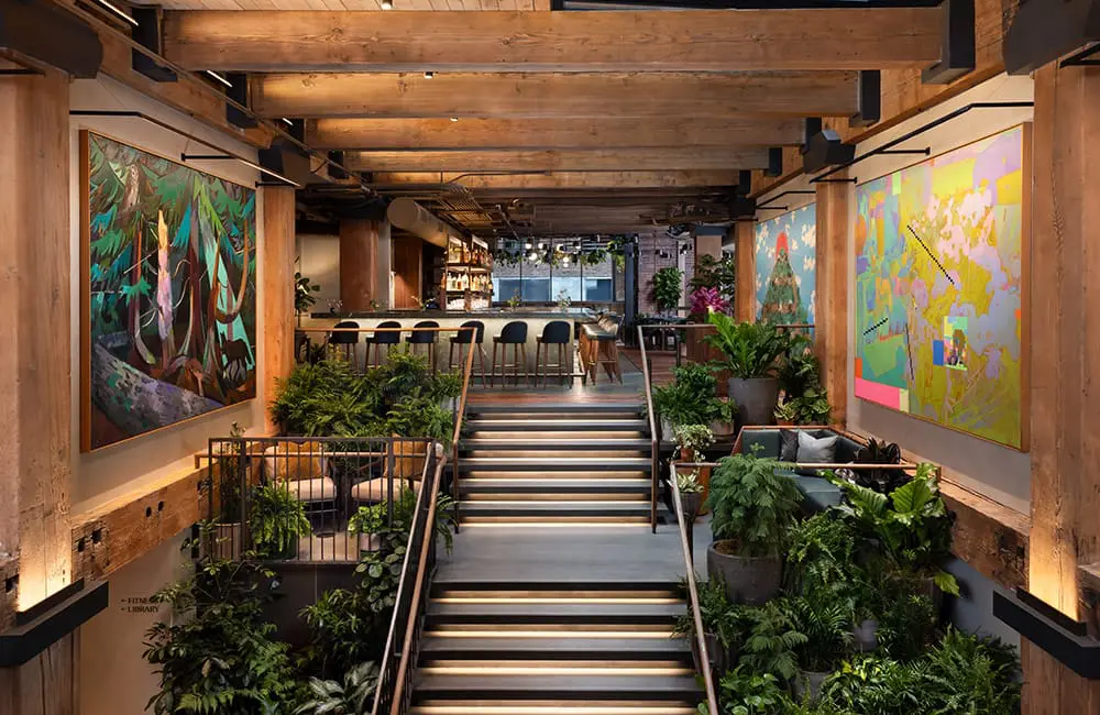 Hotel review: Downtown style meets sustainable lifestyle at Populus Seattle 2 Artwork and greenery adorn the entry stairs at Populus Seattle. Image: Ric Stovall