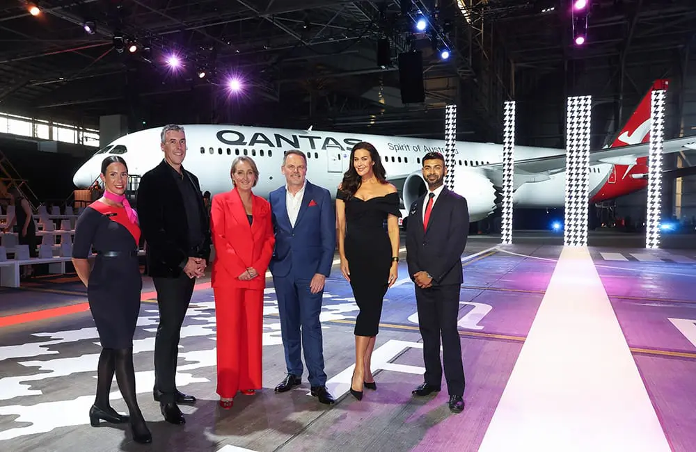 Runway to runway: Qantas & DJs take loyalty relationship to the next level at high-fashion Sydney event 2 Qantas x David Jones execs with flight attendants.