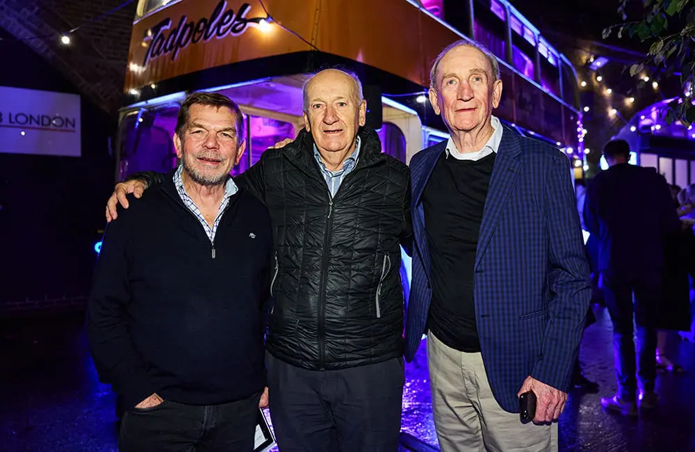 Topdeck Founders Graham "Skroo" Turner & Bill James with former Director Mick Carroll at the brand's 50th anniversary in London in 2023.