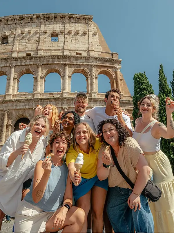 What’s a soft-reset trip? And what does it mean for the travel industry in 2026? 2 Group of young travellers in front of the Colisseum in Rome. Image: Topdeck