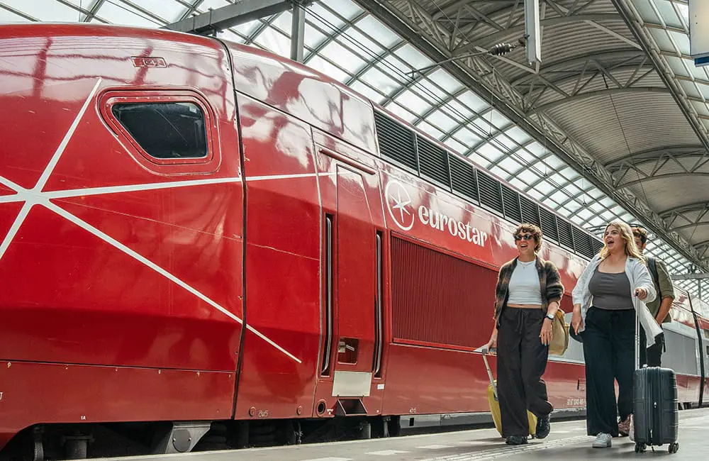 Smaller groups, bigger value: Topdeck’s new small-group travel style is packed with more for your Gen Z clients 5 Topdeck group with luggage and Eurostar train.