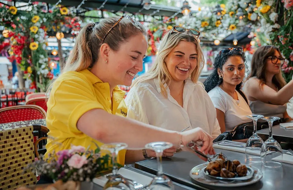 Topdeck's Founder and current MD on risk, reinvention & relevance: Why the future of youth travel starts here 6 Topdeck trip leader with group trying snails in Paris.