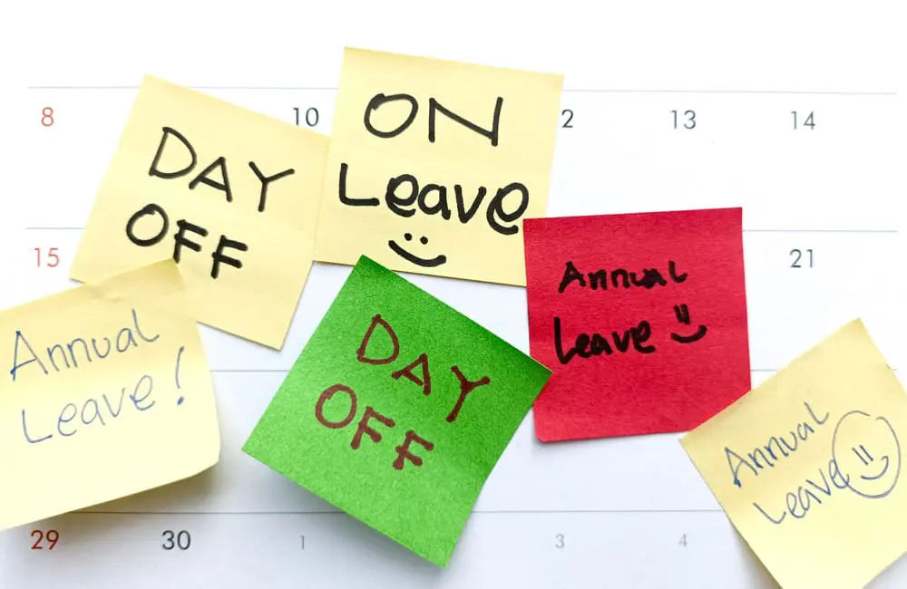 Calendar month with sticky notes about days off and annual leave – maximise your annual leave concept