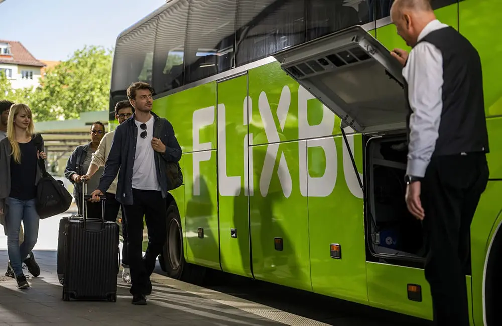 Affordable FlixBus arrives in Australia to shake up Sydney-Canberra-Melbourne travel market 1 Passengers board the distinctive FlixBus coaches.