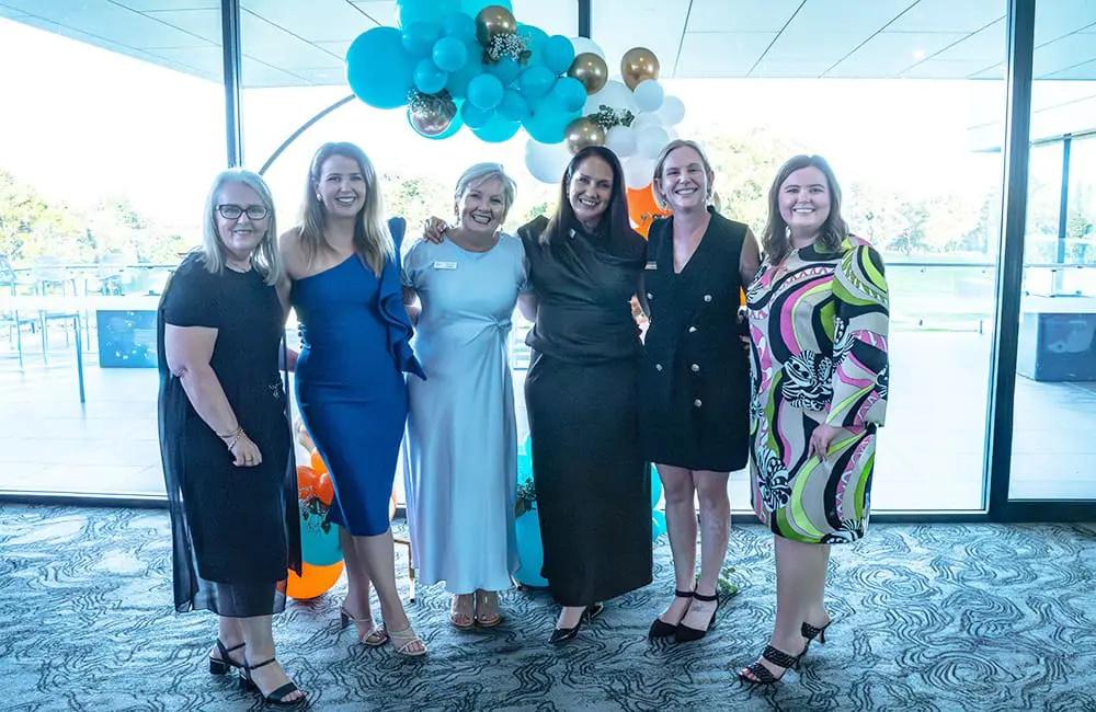 The Melhuish family with key sponsors at the Holiday World 30th anniversary event.