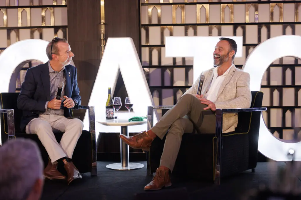 Touring and travel industry gathers for fourth CATO Christmas Lunch in Sydney 3 Sean Martin (left) chats with Gyton Grantley.
