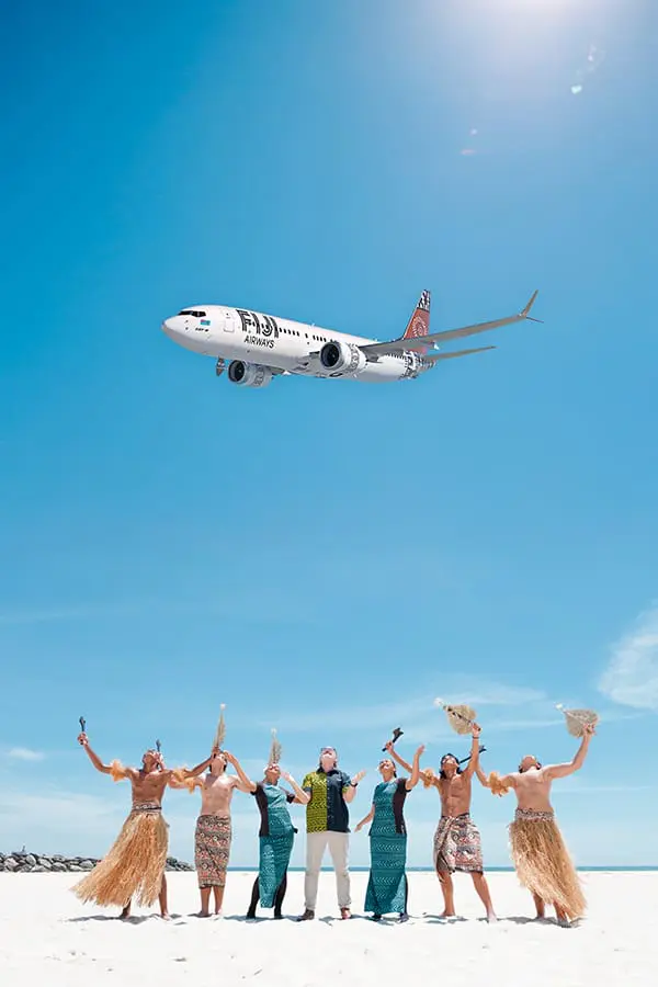 Going for the Goldie: Fiji Airways unveils nonstop Gold Coast-Fiji flights for 2026 2 Fiji Airways Boeing B787 MAX 8 aircraft flies over people on beach.