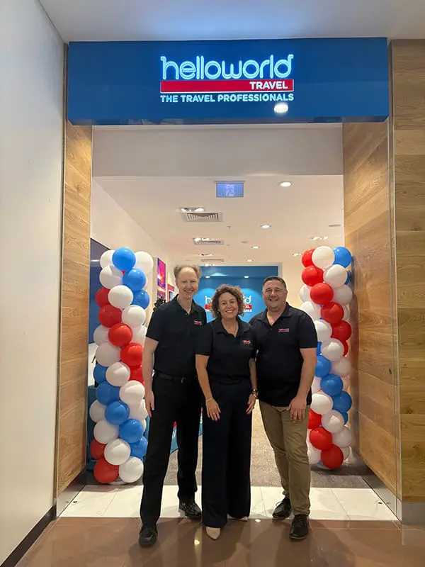 Helloworld Travel owner becomes multi-store operator with new Queensland opening 1 Helloworld Travel Mt Gravatt store owner Colin Jakins, Qld Business Manager Christine Dilger and GM Network Development Adrian Boccia at the opening.