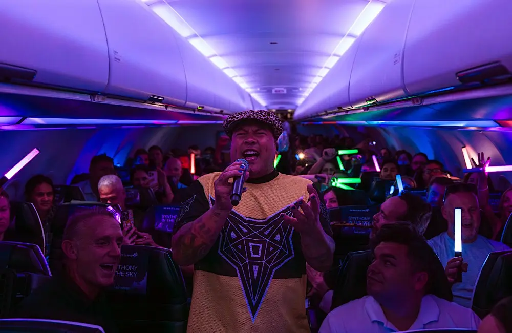 Synthony in the sky: Air New Zealand sells out mid-air concert flight 1 Shapeshifter’s P Digsss performs live inflight during Air New Zealand’s SYNTHONY in the Sky service on NZ1331.