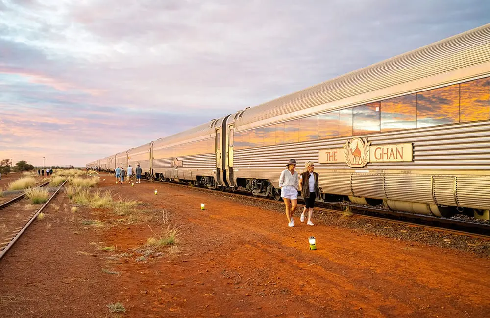 Game. Set. Travel: Journey Beyond returns for Nine’s Summer of Tennis 2 Travellers walk by The Ghan train carriages in South Australia.