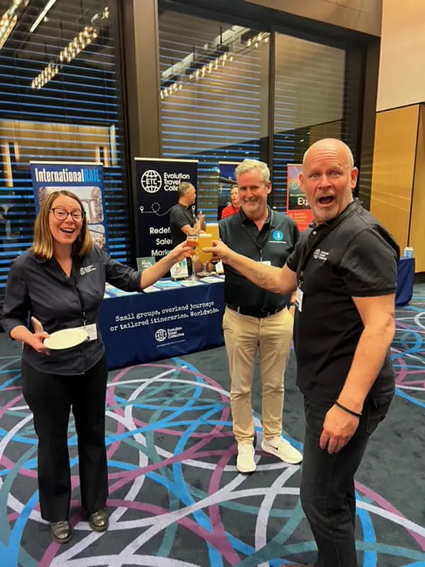 Evolution Travel Collective cheers glasses at Niche is Nice Roadshow in Melbourne
