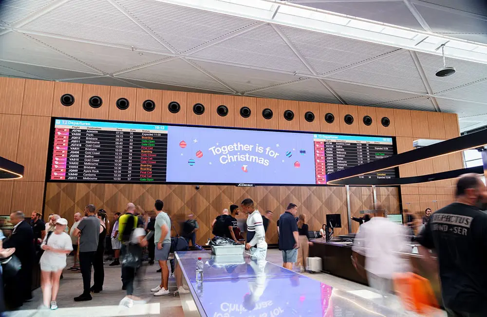 First stage of new T3 dining precinct opens as Sydney Airport predicts record festive season 5 Sydney Airport T2 domestic terminal security lanes with Christmas signage.