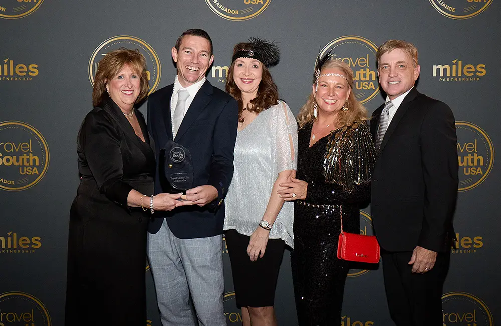 Exclusive: Travel South International Showcase 2025 brings the US South’s secret sauce to the global table 1 Travel South Ambassador Chris Watson Travel's Chris Watson and Melissah Missio (centre) with Travel South USA CEO Liz Bittner (left), Gate 7's Penny Brand (second from right) and Travel South USA Chair Mark Ezell (right).