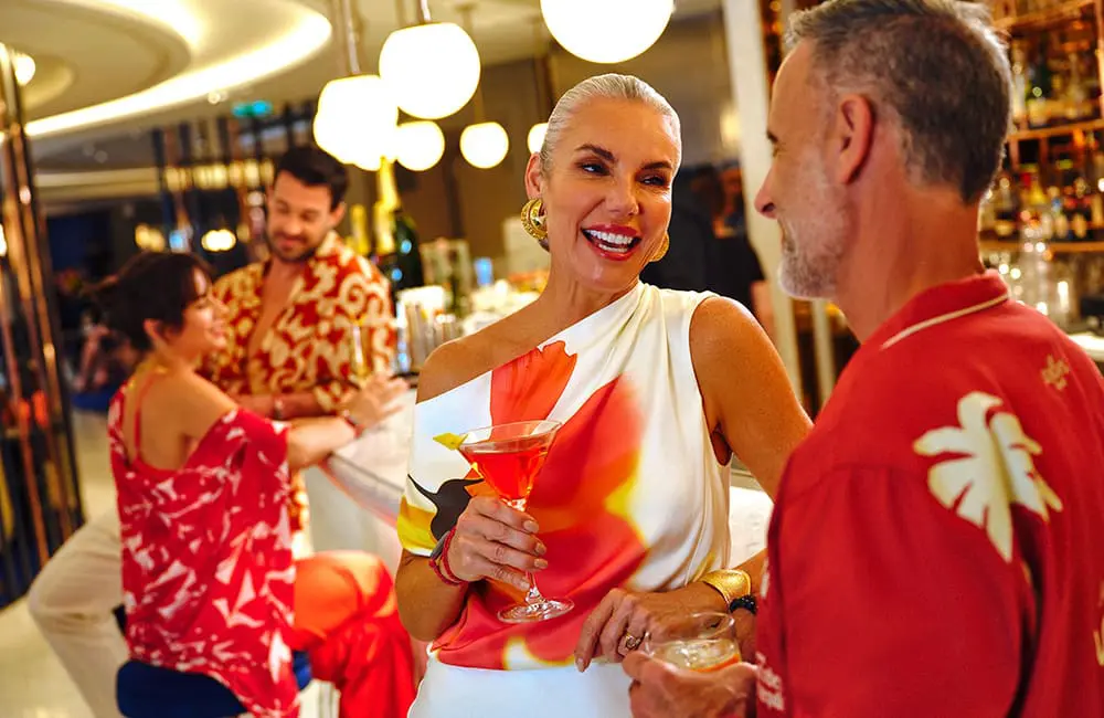 Virgin Voyages just launched a game-changing Status Match offer – are you eligible? 2 Couples at Sip on Virgin Voyages cruise ship