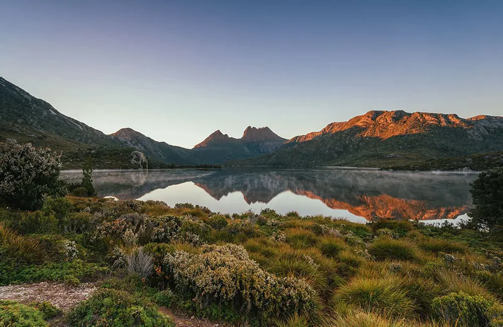 See Cradle Mountain reflected in Lake St Clair in Tasmania. 