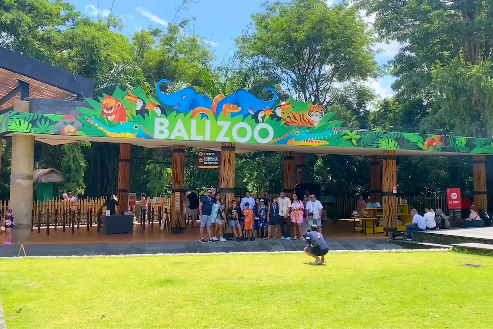 Visitors pose for a photo at Bali Zoo.