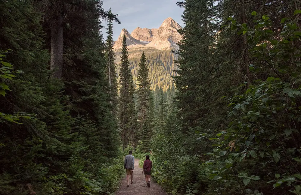 Rainforest to Rockies: couple hiking in Island Lake Lodge, Fernie. Image: Destination BC/Kari Medig