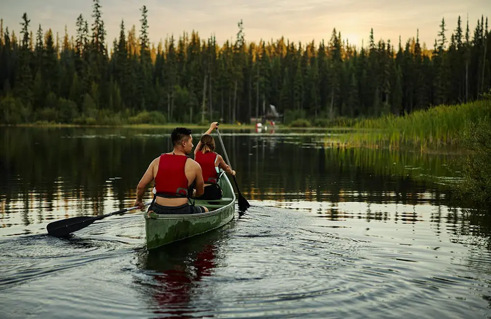 Experience BC: Kayaking on Chute Lake during sunset in the Okanagan Valley. Image: Destination BC/Huburt Kang