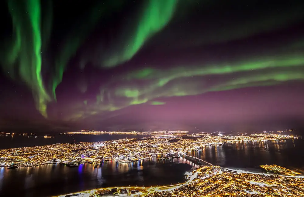 Northern Lights, bright city sights in Trømso, Norway. Image: Shutterstock