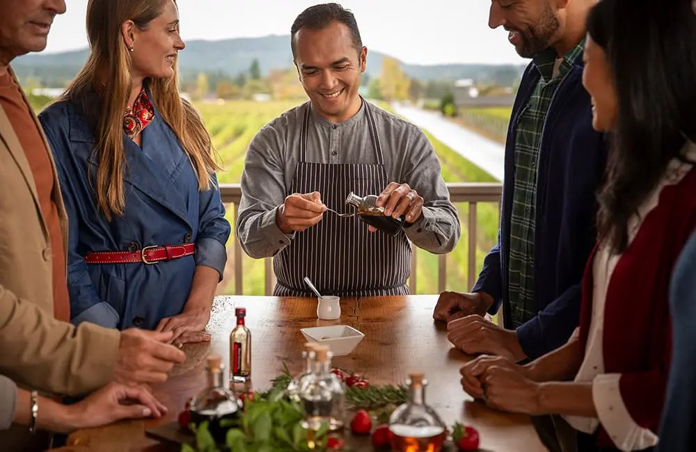 Tasting balsamic vinegar and oil on a Globus Small Group Discovery tour in Europe.