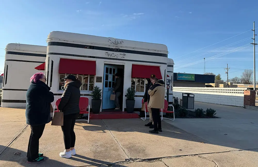 People outside the The Boots Motor Court in Carthage, MO. Image: Cassie Tannenberg