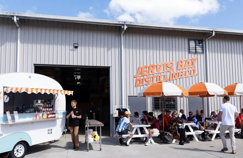Outside area at Jervis Bay Distilling Co with sign.