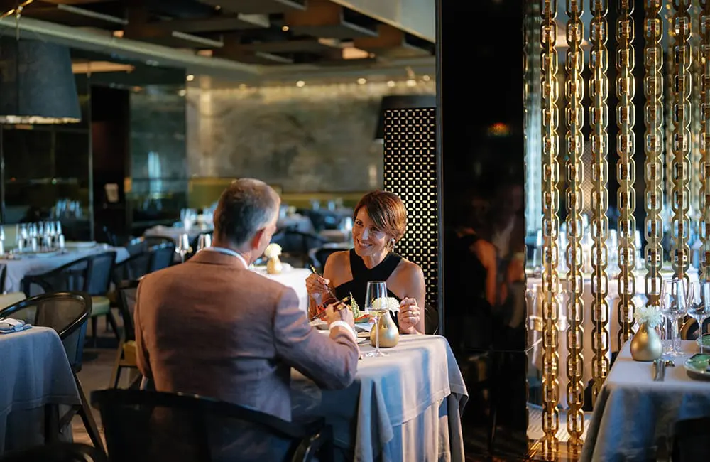 Couple at Prime 7 Steakhouse restaurant on Regent Seven Seas Splendor.