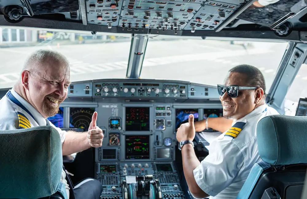 Solomon Airlines pilots in aircraft cockpit.