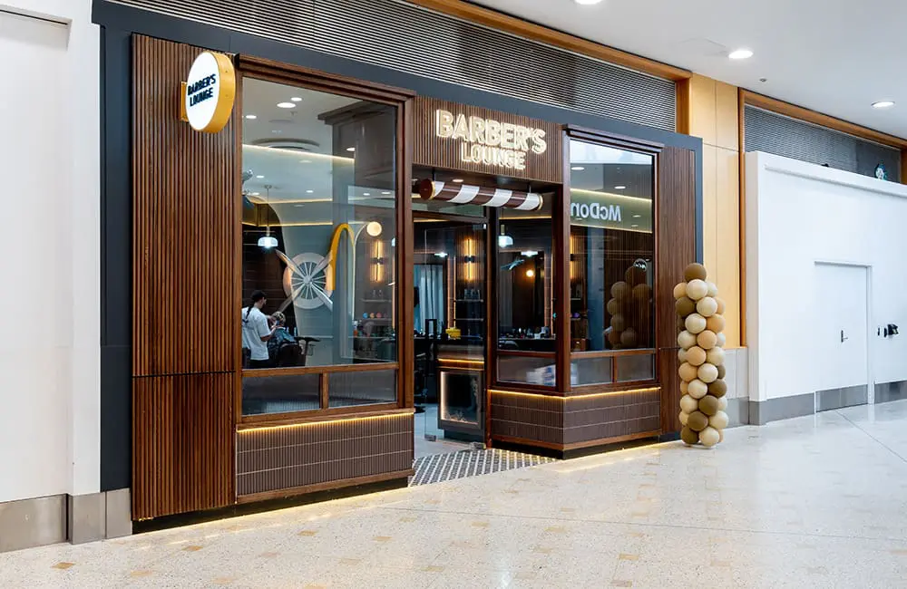 Barber's Lounge shopfront at Sydney Airport's T1 International Terminal.