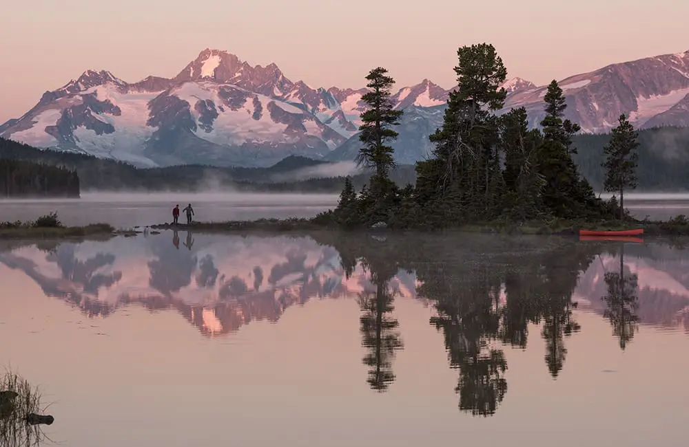 Adventurous, natural, wild: 3 more iconic British Columbia journeys for 2026 itineraries 5 Canoeists at Nuk Tessli Wilderness Experience with view of the Coast Mountains (Monarch Range), Whitton Lake, BC. Image: Destination BC