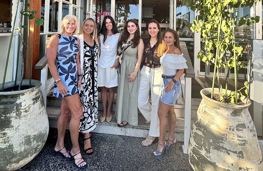 Fiona Cogar (second from left) with trade partners and some of Slojourn Studios’s Greek clients.