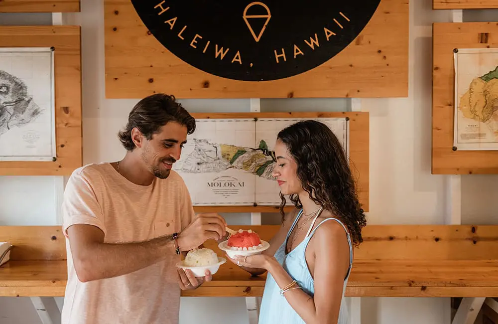 Couple enjoying desserts in Haleiwa, Oahu - 'Hawai‘i Stays With You' campaign. Image: HTA