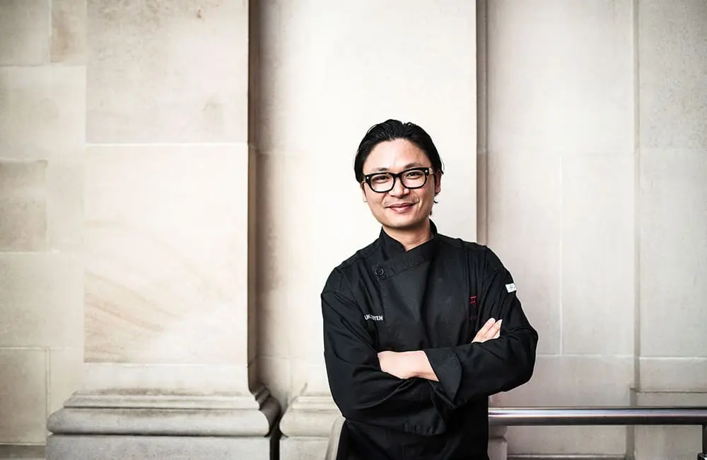Profile pic of chef Luke Nguyen against a wall.