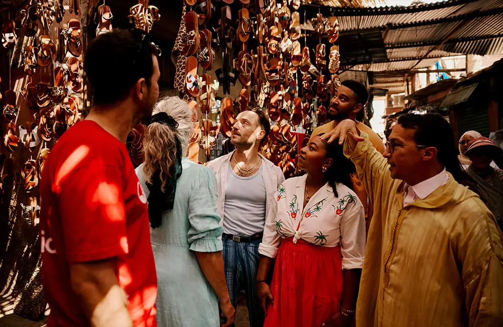 Intrepid Travel guide and group walking in a medina in Marrakech, Morocco – Intrepid Travel Golden Gap year competition