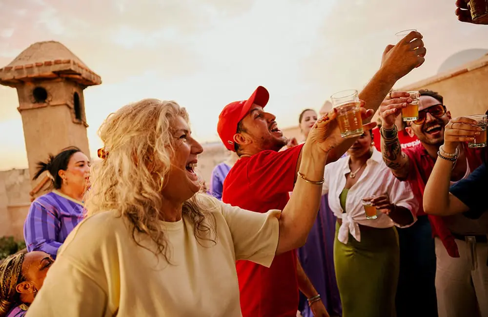 Intrepid Travel group raise glasses in a Marrakech riad in Morocco – Intrepid Travel Golden Gap year competition