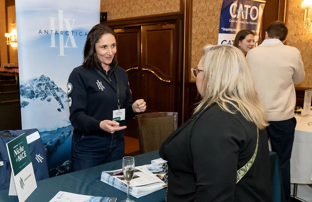 HX Expeditions ANZ Sales Director Amber Wilson chats to advisors at the Niche is Nice 2025 Melbourne marketplace.