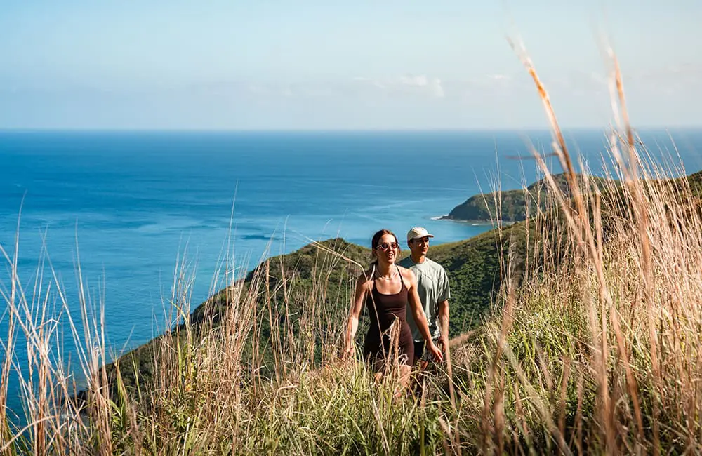 Couple hiking at Waya Island Resort, Fiji. Image: Escape Video