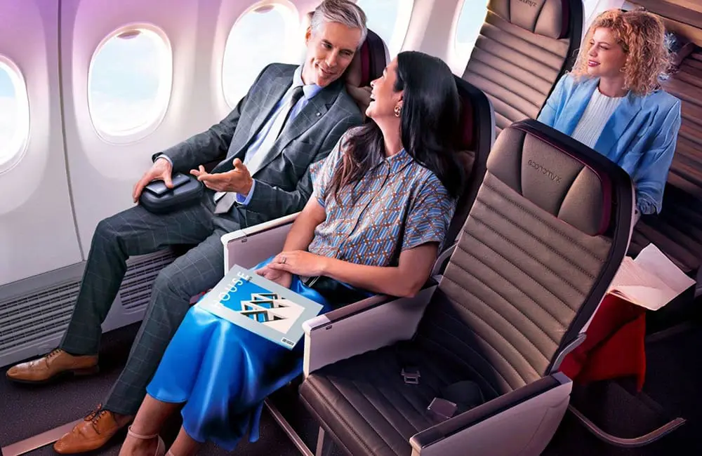 Three people seated in Virgin Australia Economy X seats.