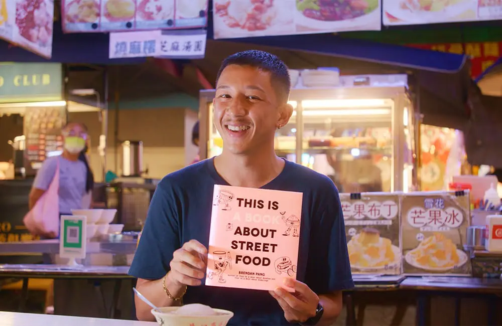 Profile pic of chef Brendan Pang in an Asian food hall.
