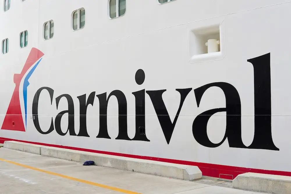 The logo of a Carnival cruise ship in the Caribbean.
