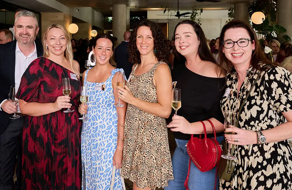 Group of attendees raise a glass to women's achievements in travel at the 2026 CATO IWD Lunch.
