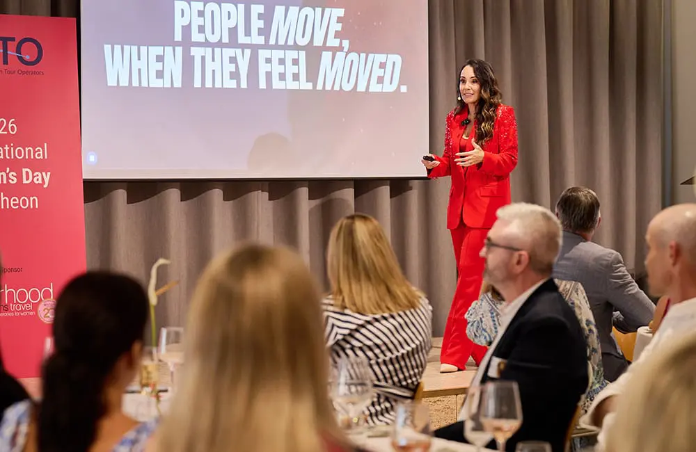 Guest speaker Nicole Joy on stage at 2026 CATO IWD Lunch.