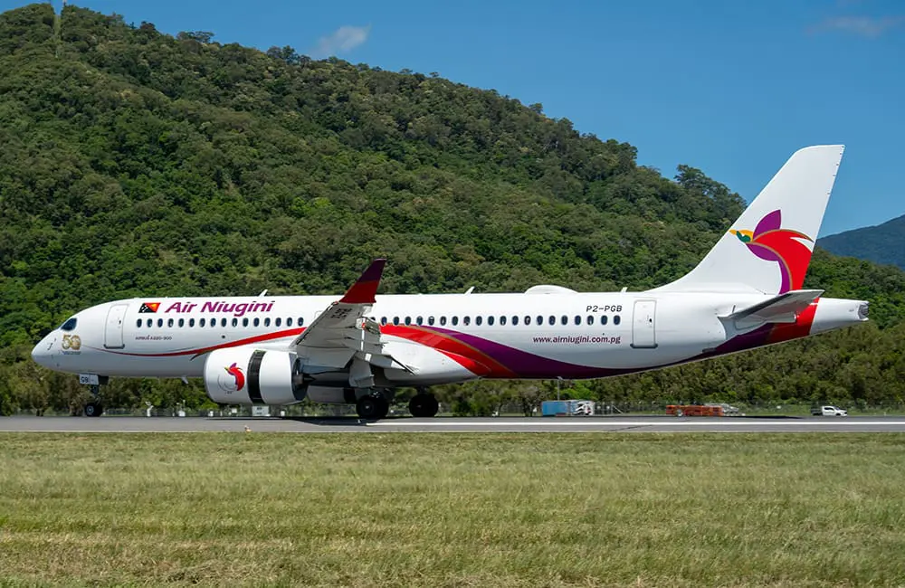 Air Niugini Airbus A220-300 aircraft lands at Cairns Airport. Image: Bang Media