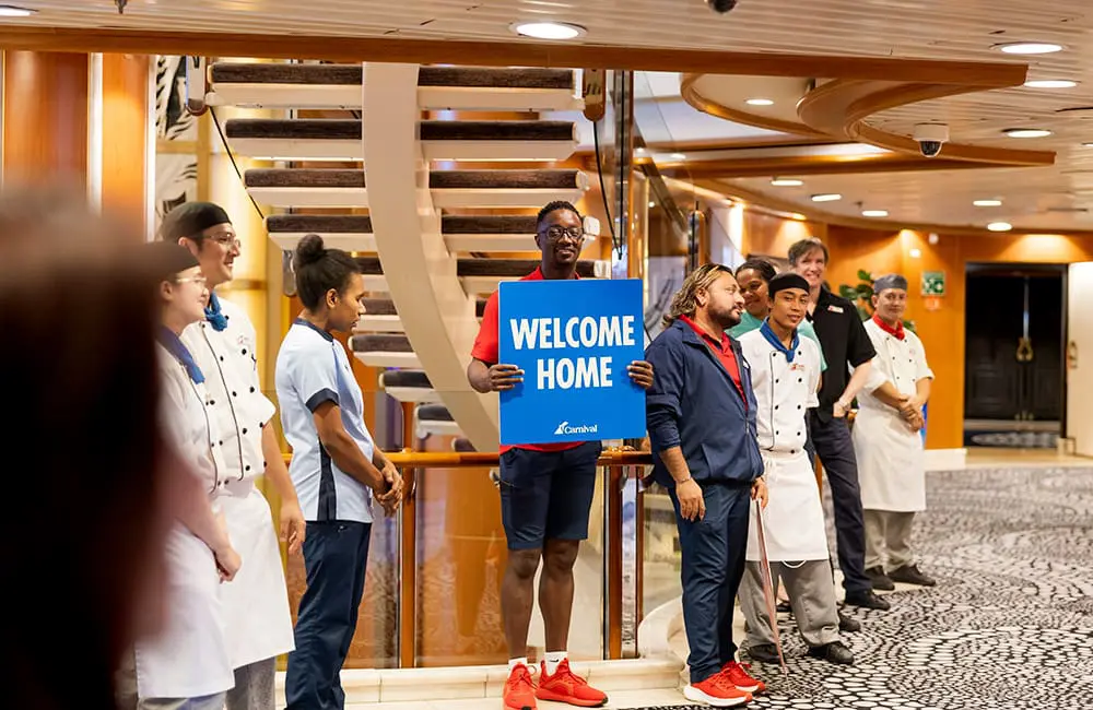 Crew welcome the first guests on board the refreshed Carnival Encounter in Brisbane.