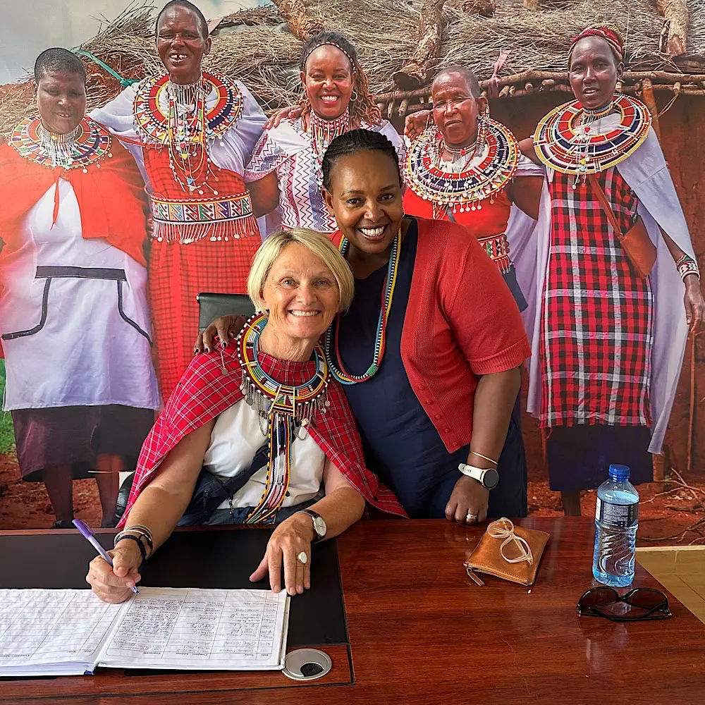 Australian travel agent Carolyn Allen with Patinaai Osim founder Semerian, whose grassroots initiative is supporting Maasai women and girls through education and skills training.