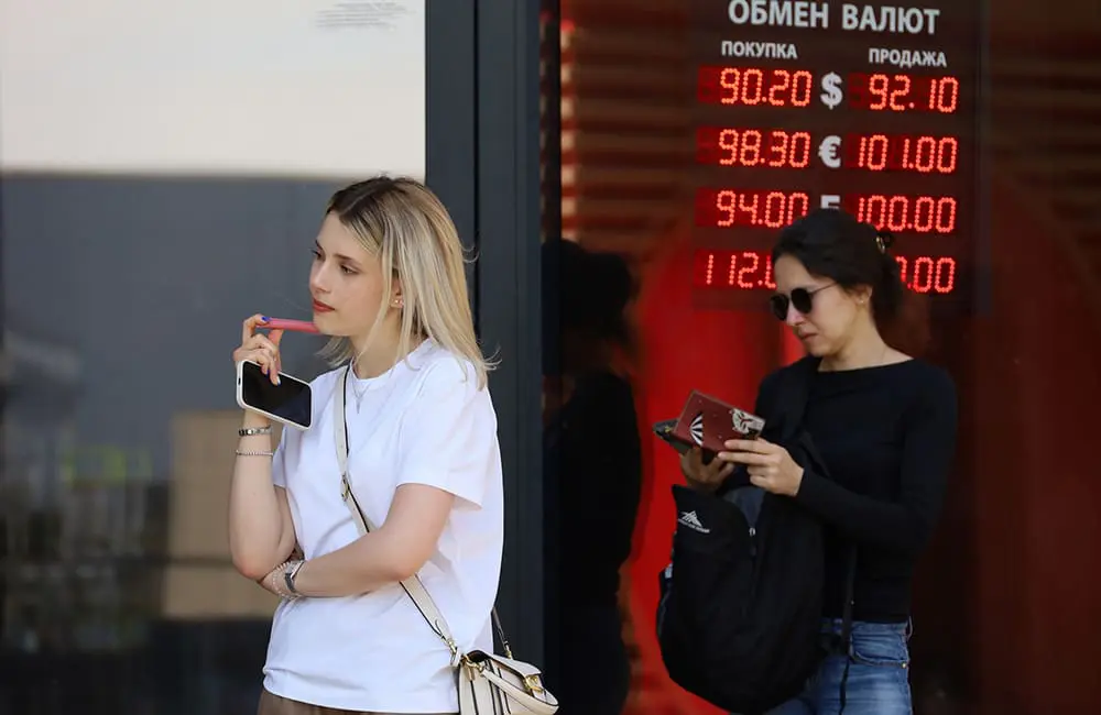 Cash is still king: 84% of Aussies choose to carry currency when they travel abroad 3 Women waiting outside currency exchange store in Moscow, Russia. Image: Oleg Elkov/iStock