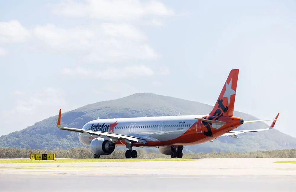 Sunshine Coast goes global: First Jetstar flight launches to Bali and Singapore 3 Jetstar aircraft on tarmac at Sunshine Coast Airport