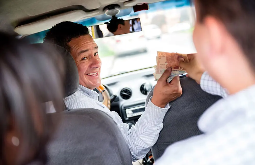 Cash is still king: 84% of Aussies choose to carry currency when they travel abroad 2 Taxi cash payment Image: andresr/iStock